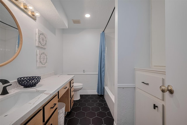 2831 Thorne Creek Ln, Houston, TX 77073 - full bath featuring vanity, toilet, shower / tub combo, a textured ceiling, and tile patterned floors