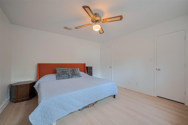 2831 Thorne Creek Ln, Houston, TX 77073 - bedroom with light wood-style floors, baseboards, and a ceiling fan
