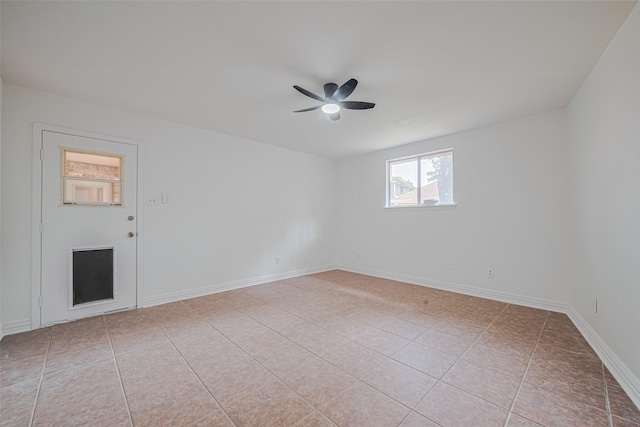 2831 Thorne Creek Ln, Houston, TX 77073 - unfurnished room featuring a ceiling fan, light tile patterned flooring, and baseboards