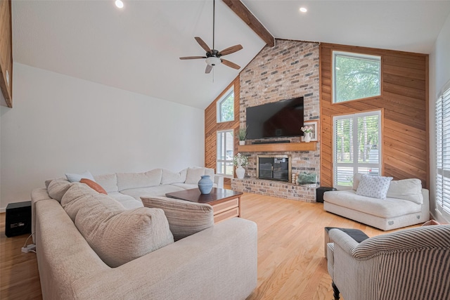 2831 Thorne Creek Ln, Houston, TX 77073 - living area featuring high vaulted ceiling, a ceiling fan, wood finished floors, beamed ceiling, and wooden walls