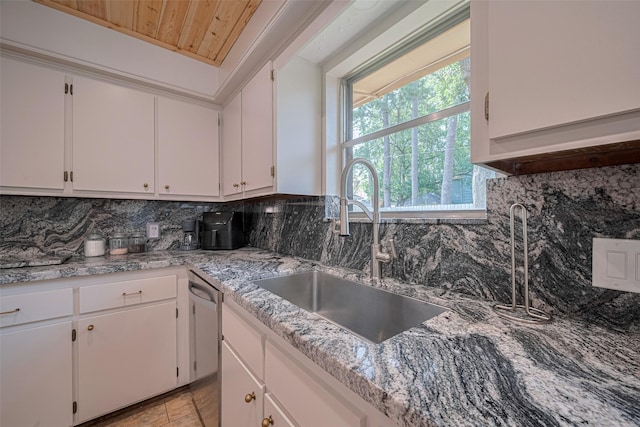 2831 Thorne Creek Ln, Houston, TX 77073 - kitchen with a sink, wood ceiling, white cabinetry, and stainless steel dishwasher