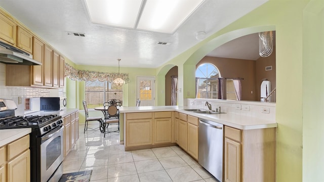 12422 Glenleigh Dr, Houston, TX 77014 - kitchen featuring stainless steel appliances, light brown cabinets, a sink, and decorative backsplash