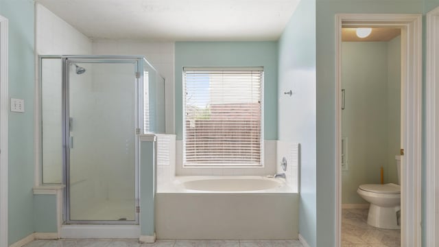 12422 Glenleigh Dr, Houston, TX 77014 - full bathroom with a garden tub, a stall shower, and toilet