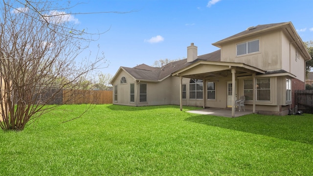 12422 Glenleigh Dr, Houston, TX 77014 - rear view of house featuring a chimney, a patio area, and stucco siding