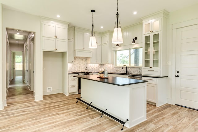 5206 4th St, Danbury, TX 77534 - kitchen with dark countertops, appliances with stainless steel finishes, light wood finished floors, healthy amount of natural light, and recessed lighting