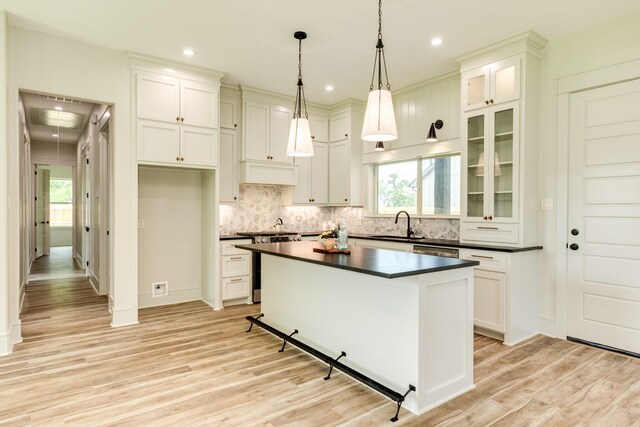5206 4th St, Danbury, TX 77534 - kitchen featuring dark countertops, stainless steel appliances, light wood-style flooring, healthy amount of natural light, and recessed lighting