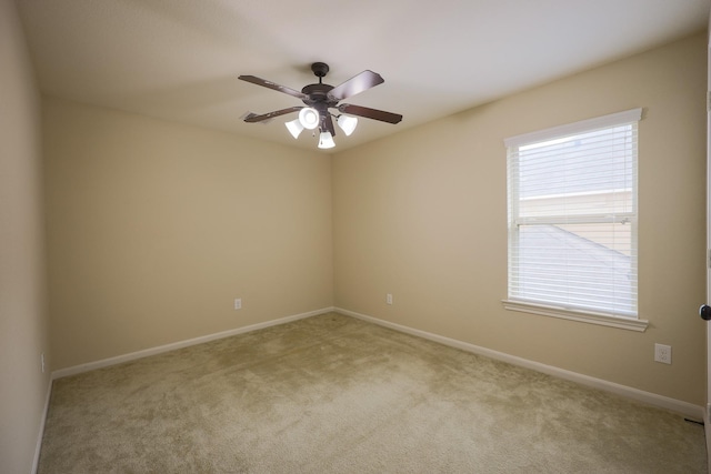 6707 Hunters Creek Ln, Baytown, TX 77521 - unfurnished room with light colored carpet, a ceiling fan, and baseboards