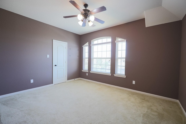 6707 Hunters Creek Ln, Baytown, TX 77521 - empty room featuring light carpet, a ceiling fan, and baseboards