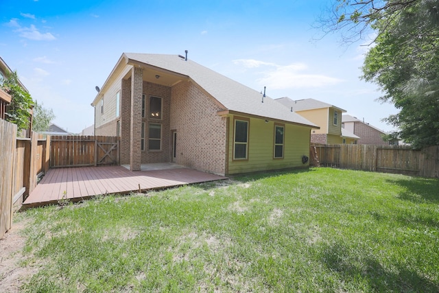 6707 Hunters Creek Ln, Baytown, TX 77521 - back of property with brick siding and a wooden deck