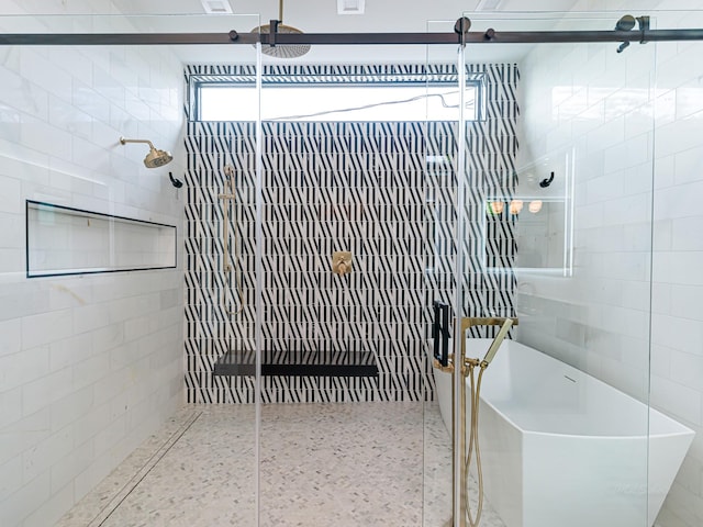 2037 Norfolk St, Houston, TX 77098 - full bath featuring a tile shower, a soaking tub, and tile walls