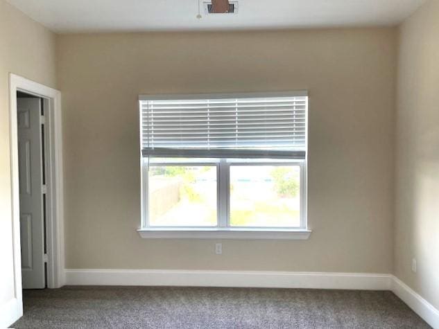 9310 Coffee St, Houston, TX 77033 - carpeted empty room with baseboards