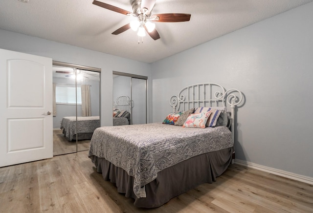 1726 Broadway Unit 19, Galveston, TX 77550 - bedroom featuring multiple closets, light wood-style floors, baseboards, and a ceiling fan