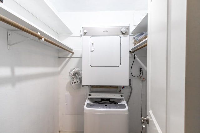 1726 Broadway Unit 19, Galveston, TX 77550 - washroom featuring stacked washer / drying machine