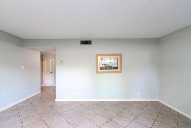 1726 Broadway Unit 19, Galveston, TX 77550 - empty room with light tile patterned flooring and baseboards