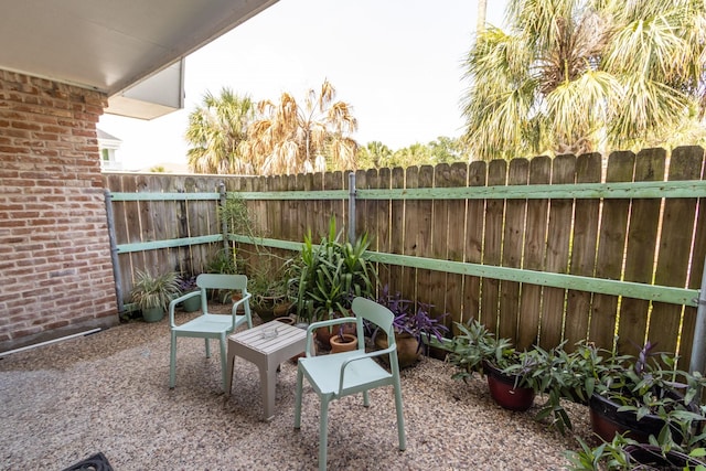 1726 Broadway Unit 19, Galveston, TX 77550 - fenced backyard featuring a patio