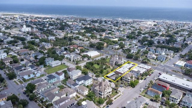 1726 Broadway Unit 19, Galveston, TX 77550 - aerial view of property and surrounding area featuring property parcel outlined and a large body of water