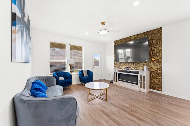 21123 Coral Blossom Ln, Cypress, TX 77433 - living room with ceiling fan, light wood finished floors, baseboards, a glass covered fireplace, and recessed lighting