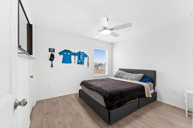 21123 Coral Blossom Ln, Cypress, TX 77433 - bedroom with light wood finished floors, baseboards, and ceiling fan