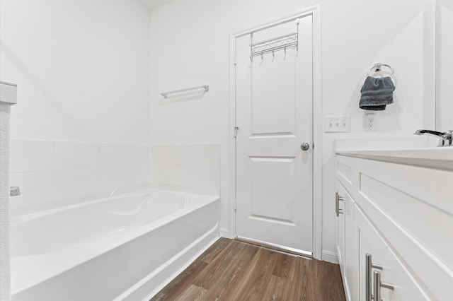 21123 Coral Blossom Ln, Cypress, TX 77433 - full bath with a bath, wood finished floors, and vanity