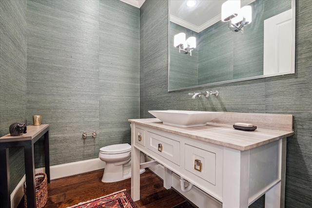 6021 Fordham St, West University Place, TX 77005 - bathroom featuring a chandelier, vanity, toilet, wood finished floors, and ornamental molding