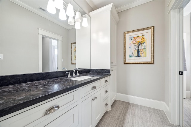 6021 Fordham St, West University Place, TX 77005 - bathroom featuring vanity, ornamental molding, and baseboards