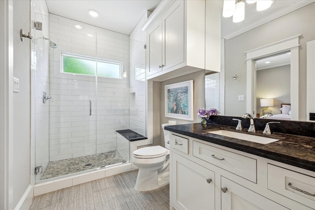 6021 Fordham St, West University Place, TX 77005 - ensuite bathroom with a stall shower, vanity, toilet, crown molding, and recessed lighting