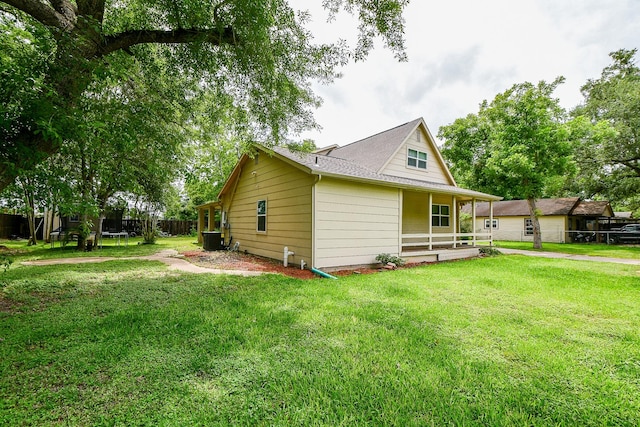 15115 Monrad Dr, Houston, TX 77053 - view of home's exterior with covered porch, central AC, and roof with shingles