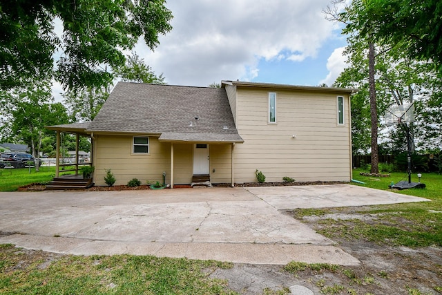 15115 Monrad Dr, Houston, TX 77053 - rear view of house featuring a patio and roof with shingles