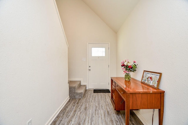 15115 Monrad Dr, Houston, TX 77053 - foyer entrance with wood finished floors, baseboards, and lofted ceiling