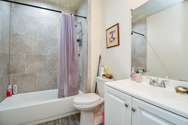 15115 Monrad Dr, Houston, TX 77053 - full bathroom featuring shower / bath combo, vanity, toilet, and wood finished floors