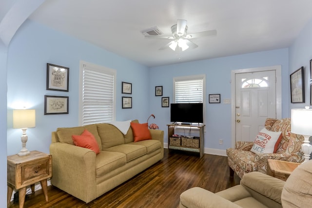 1523 22nd St, Galveston, TX 77550 - living area with dark wood finished floors, ceiling fan, and baseboards