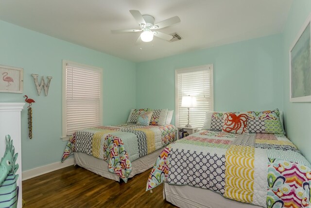 1523 22nd St, Galveston, TX 77550 - bedroom featuring wood finished floors, baseboards, and ceiling fan