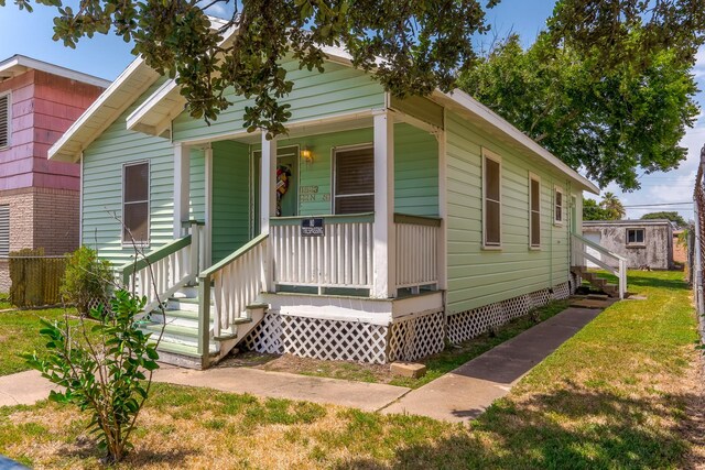 1523 22nd St, Galveston, TX 77550 - view of front of home with covered porch