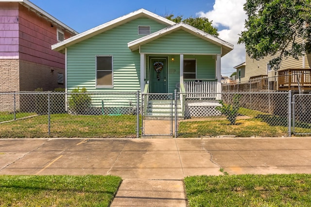 1523 22nd St, Galveston, TX 77550 - view of front of house with a gate and covered porch