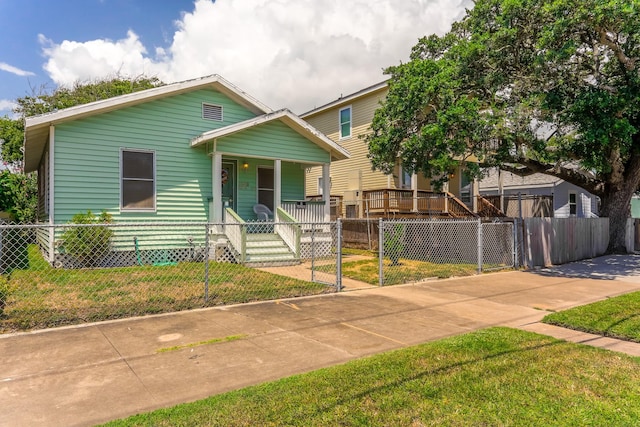 1523 22nd St, Galveston, TX 77550 - view of front of home with a porch and a gate