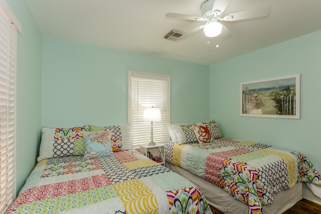 1523 22nd St, Galveston, TX 77550 - bedroom featuring a ceiling fan and wood finished floors