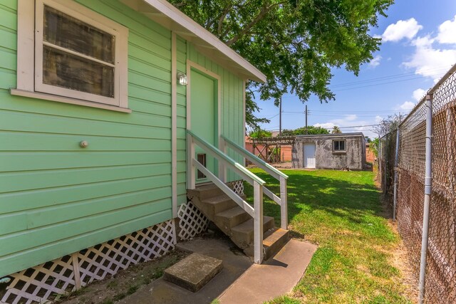 1523 22nd St, Galveston, TX 77550 - view of yard featuring entry steps and an outdoor structure