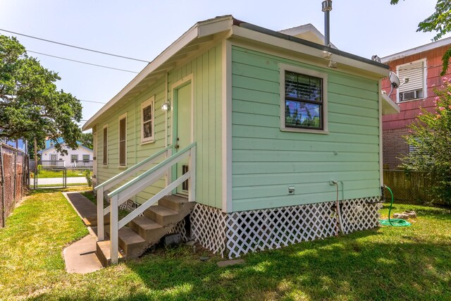 1523 22nd St, Galveston, TX 77550 - rear view of property with entry steps