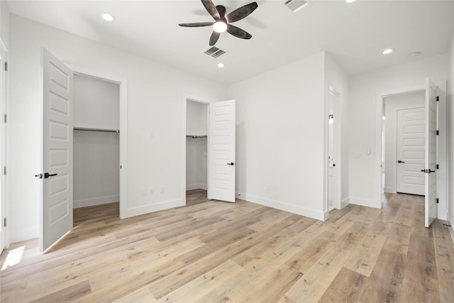 8618 Lee Otis St A-B, Unit A-B Houston, TX 77051 - unfurnished bedroom with light wood finished floors, baseboards, recessed lighting, a walk in closet, and ceiling fan