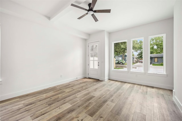 8618 Lee Otis St A-B, Unit A-B Houston, TX 77051 - spare room with healthy amount of natural light, a ceiling fan, light wood finished floors, baseboards, and beamed ceiling