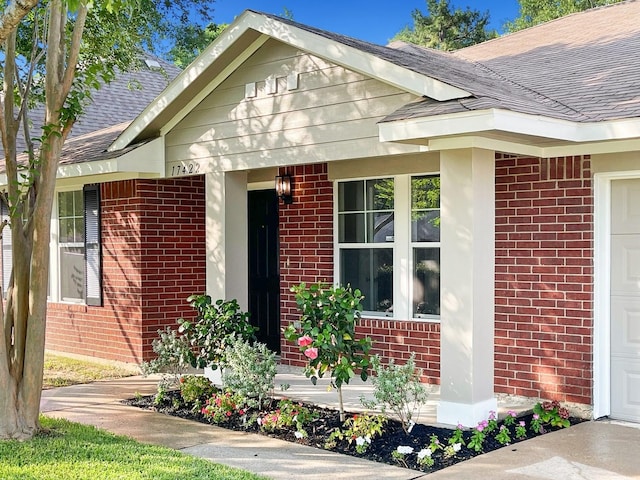 17422 Typhoon Way, Crosby, TX 77532 - entrance to property featuring brick siding and a shingled roof