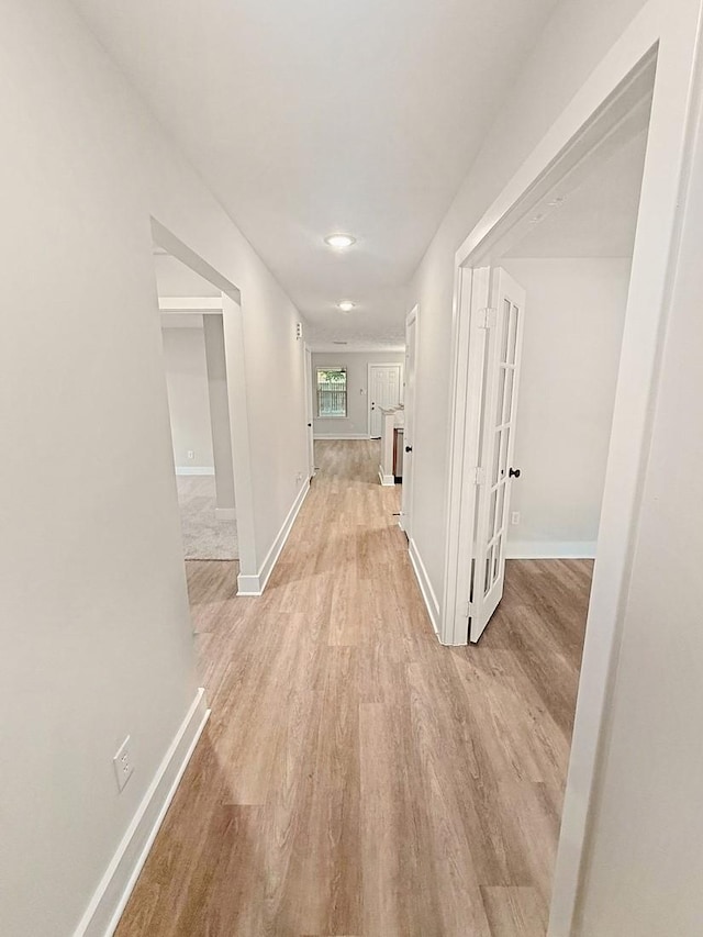 17422 Typhoon Way, Crosby, TX 77532 - corridor featuring light wood-type flooring and baseboards