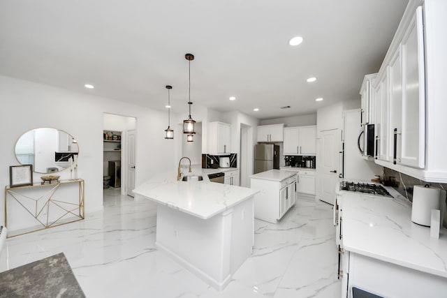 29007 Dryander Forest Ct, Katy, TX 77494 - kitchen featuring stainless steel appliances, recessed lighting, white cabinetry, a sink, and light stone countertops