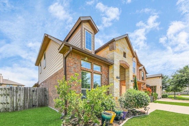 29007 Dryander Forest Ct, Katy, TX 77494 - view of home's exterior featuring brick siding, stone siding, and concrete driveway