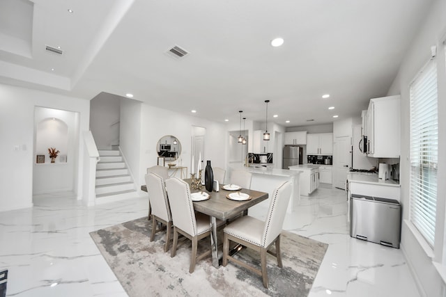 29007 Dryander Forest Ct, Katy, TX 77494 - dining room featuring stairs, healthy amount of natural light, recessed lighting, and light marble finish floors