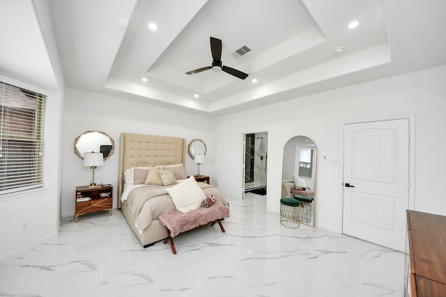 29007 Dryander Forest Ct, Katy, TX 77494 - bedroom with a raised ceiling, baseboards, light marble finish floors, recessed lighting, and arched walkways