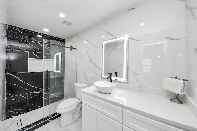 29007 Dryander Forest Ct, Katy, TX 77494 - full bath featuring vanity, toilet, a marble finish shower, and recessed lighting