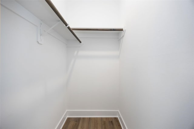 8023 Cora St, Houston, TX 77088 - walk in closet with dark wood-style floors