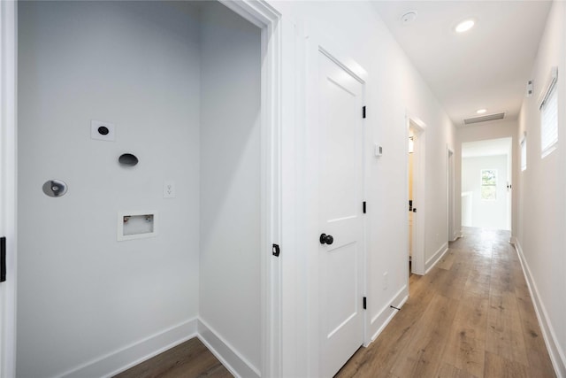 8023 Cora St, Houston, TX 77088 - laundry area with hookup for an electric dryer, hookup for a washing machine, light wood finished floors, baseboards, and recessed lighting