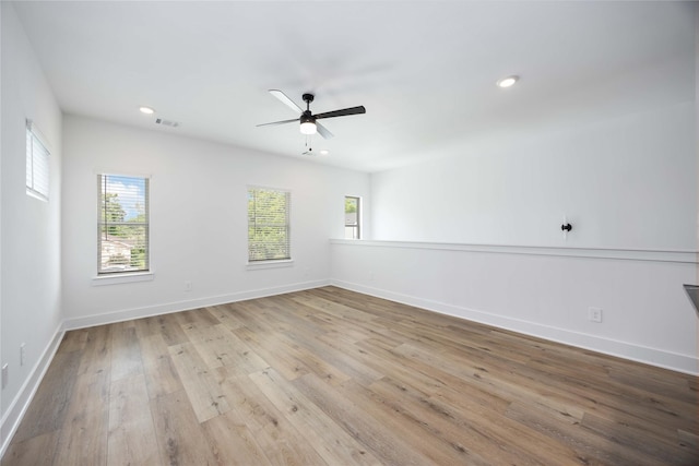 8019 Cora St, Houston, TX 77088 - empty room with healthy amount of natural light, baseboards, wood finished floors, a ceiling fan, and recessed lighting